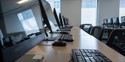 Desktop computers set up in a classroom