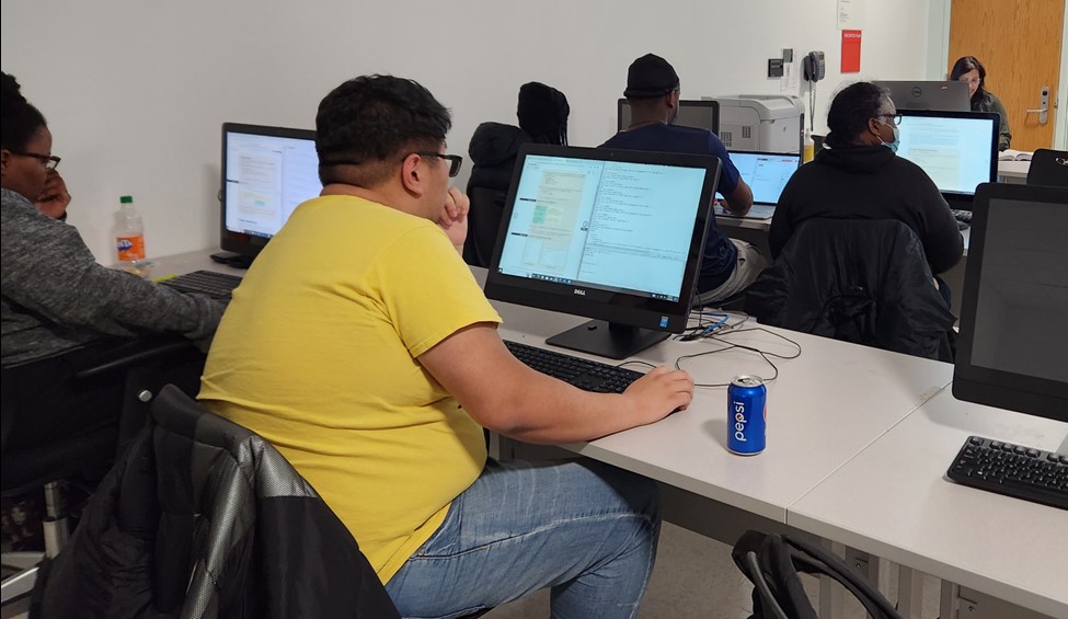 Users in a classroom on computers.