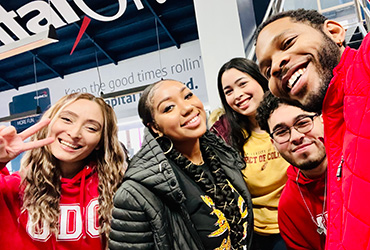 Members of the UDC Chorale taking a selfie at the Capital Center arena