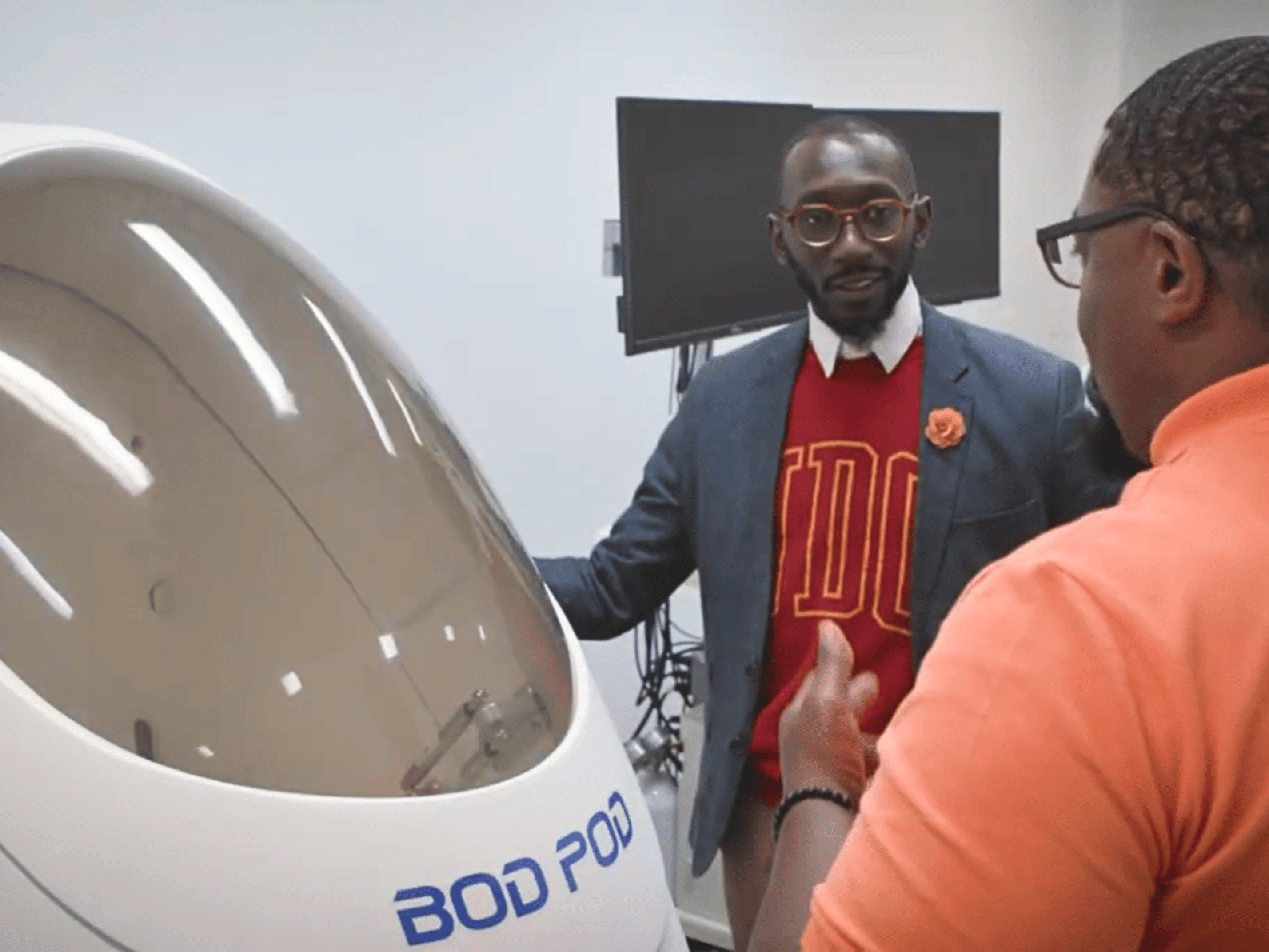 Staff inside of the Firebird Nutrition Assessment Lab with Bod Pod.