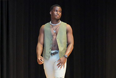 Young man in a fashion show.