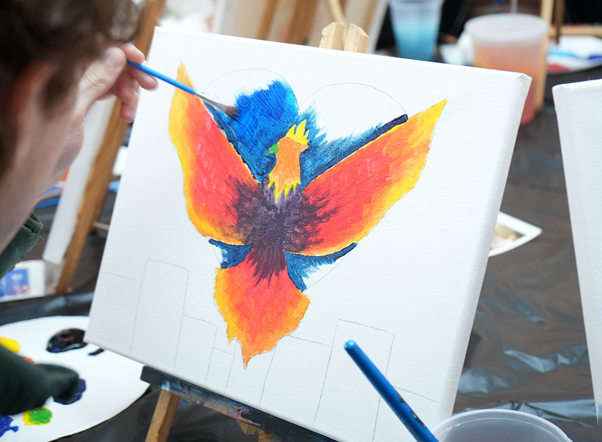 Two women with their arms around each other and smiling.