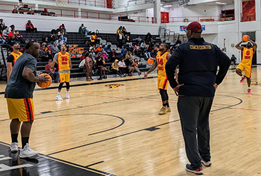 Coach Edington coaching the alumni basketball game.