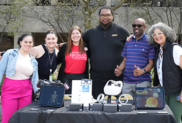 CAL staff standing outside at a table