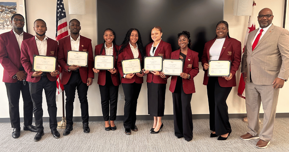 Student ambassadors holding their certificates